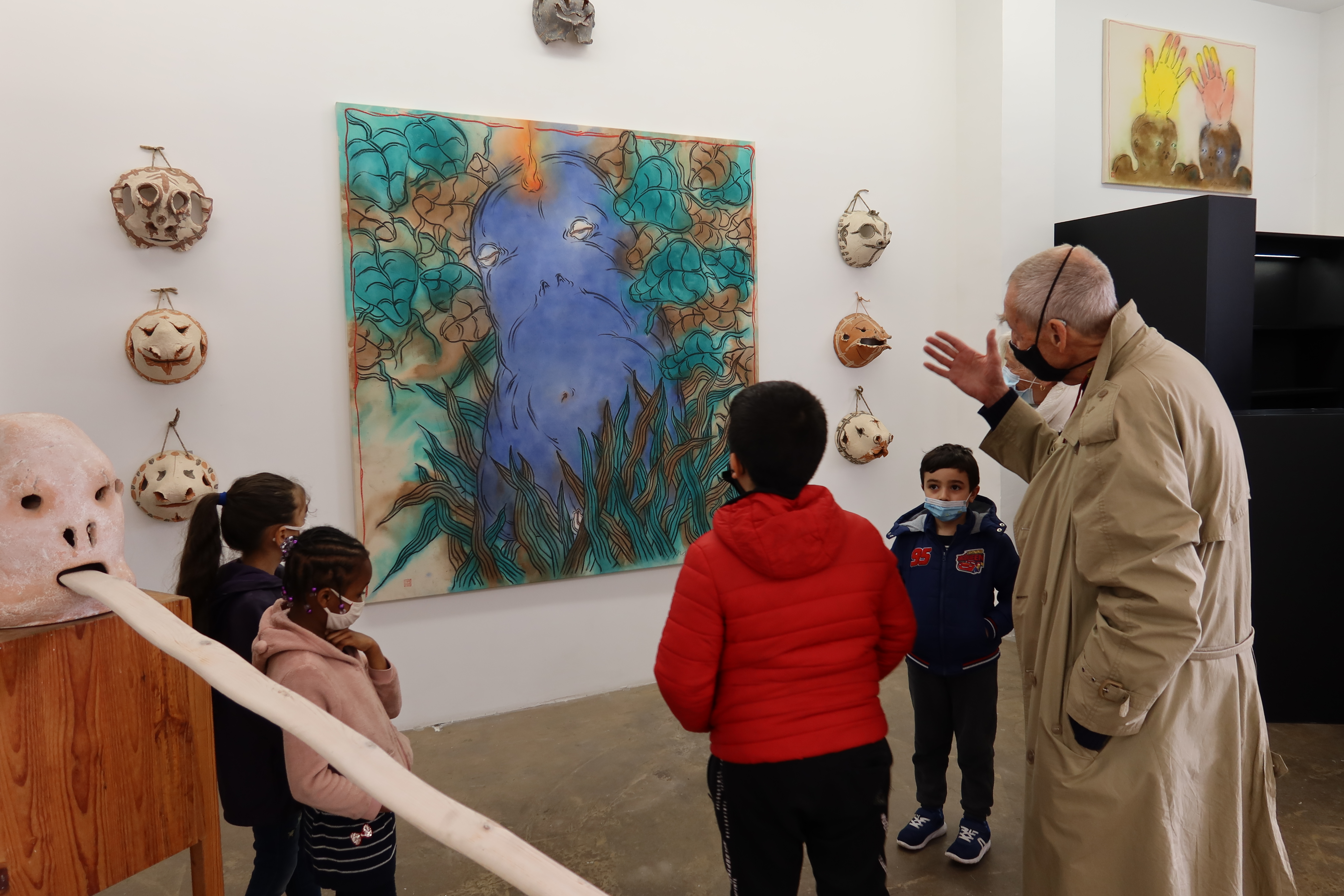 The artist, Mark Bruss, takes a guided tour of his children’s exhibition.